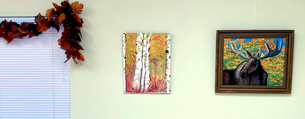 A painting of trees with yellow leaves on them.